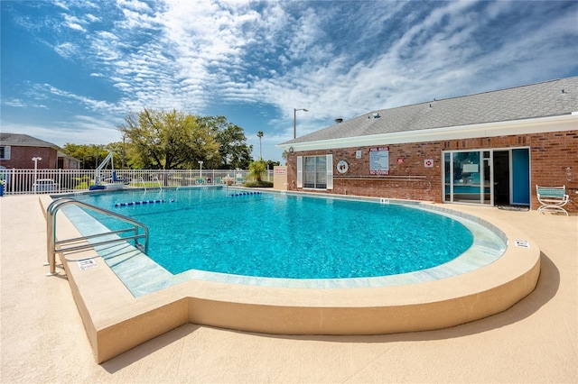 view of swimming pool with a patio area