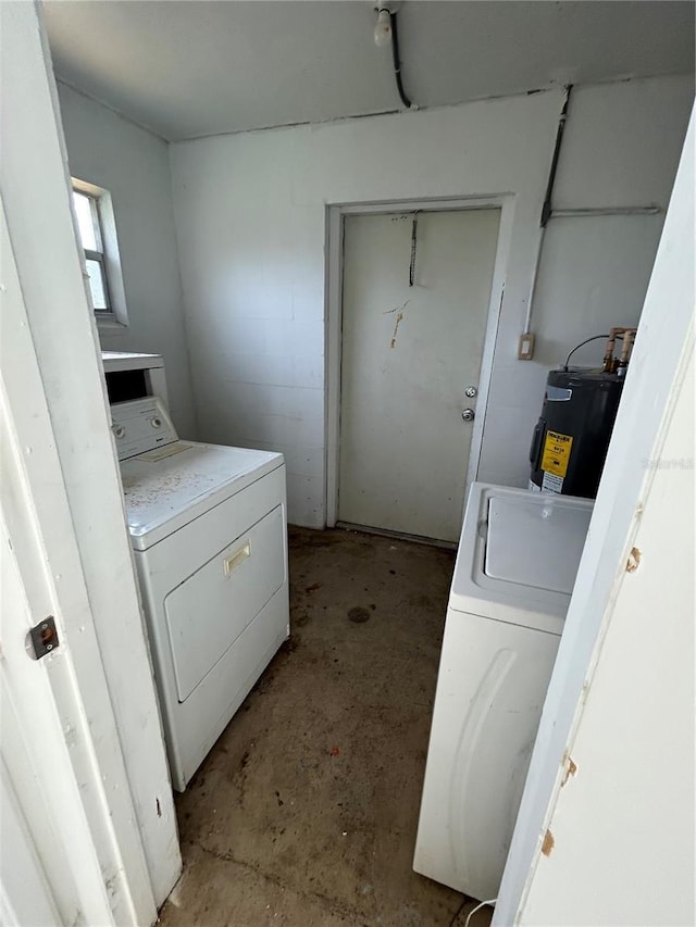 laundry area with independent washer and dryer and water heater