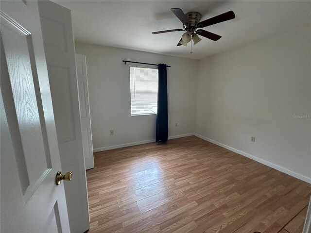 183 Bamboo Dr Unit B, Port Charlotte, FL 33954 - unfurnished room with light wood-style floors and a ceiling fan