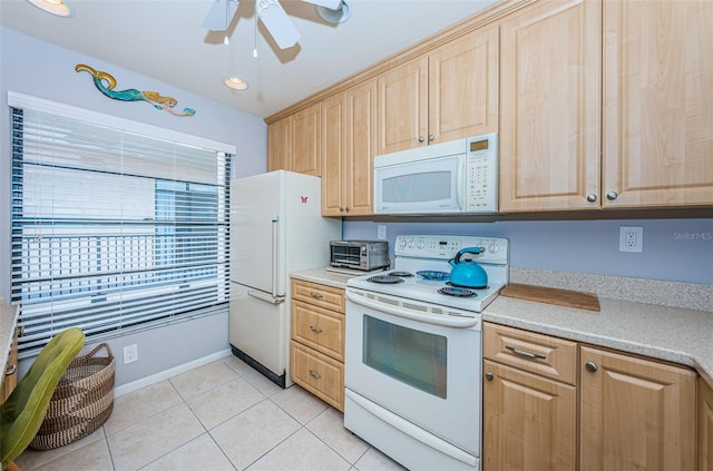 kitchen with light tile patterned flooring, white appliances, ceiling fan, and light brown cabinets