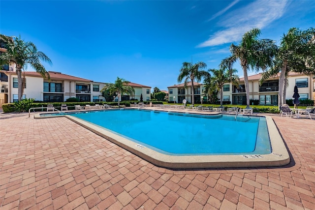 view of swimming pool with a patio area