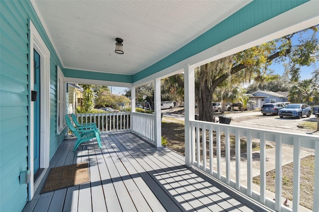 wooden deck featuring covered porch