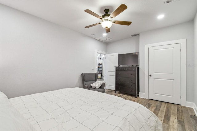 bedroom with hardwood / wood-style flooring and ceiling fan