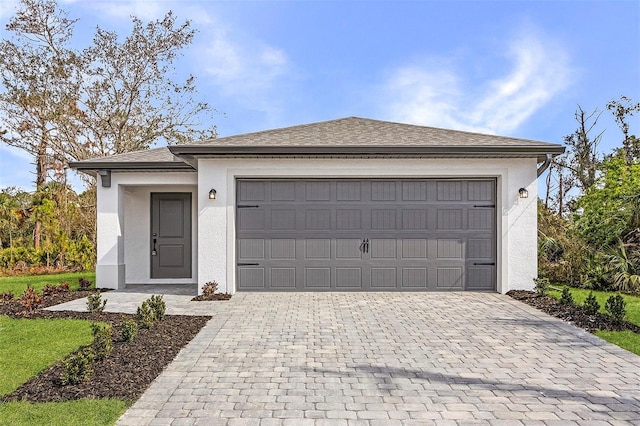 3418 Eagle Pass St, North Port, FL 34286 - garage featuring decorative driveway