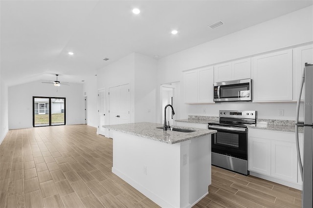 3418 Eagle Pass St, North Port, FL 34286 - kitchen featuring stainless steel appliances, a sink, visible vents, a ceiling fan, and wood tiled floor