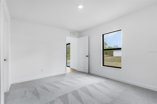 3418 Eagle Pass St, North Port, FL 34286 - spare room featuring baseboards, visible vents, and carpet floors