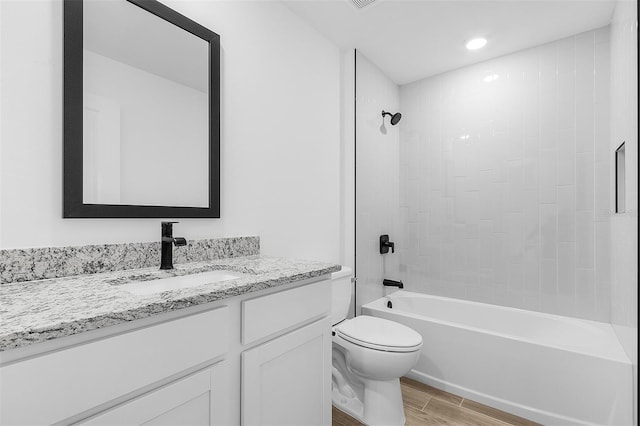 3418 Eagle Pass St, North Port, FL 34286 - bathroom with shower / bathing tub combination, toilet, wood finished floors, and vanity