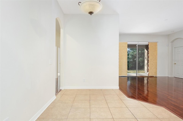 hallway featuring light tile patterned floors