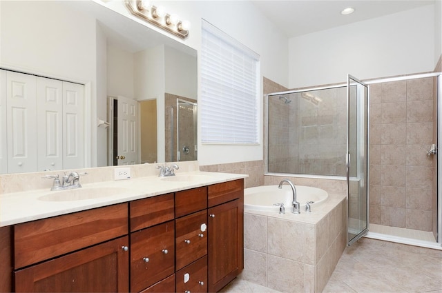 bathroom featuring vanity, independent shower and bath, and tile patterned flooring