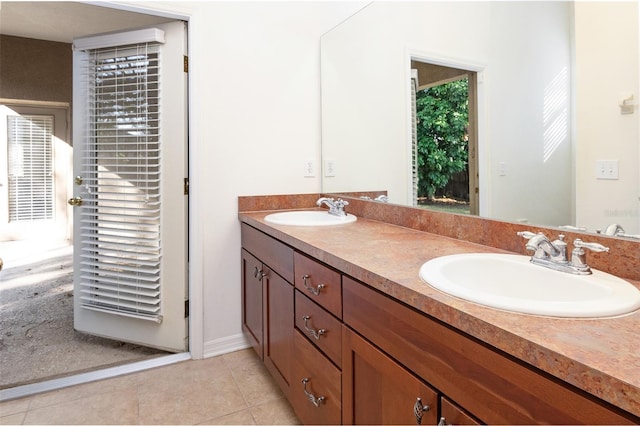 bathroom featuring vanity, tile patterned floors, and plenty of natural light