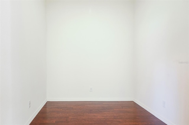 unfurnished room featuring dark hardwood / wood-style floors