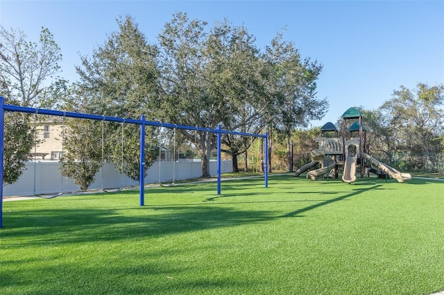 exterior space featuring a playground and a yard