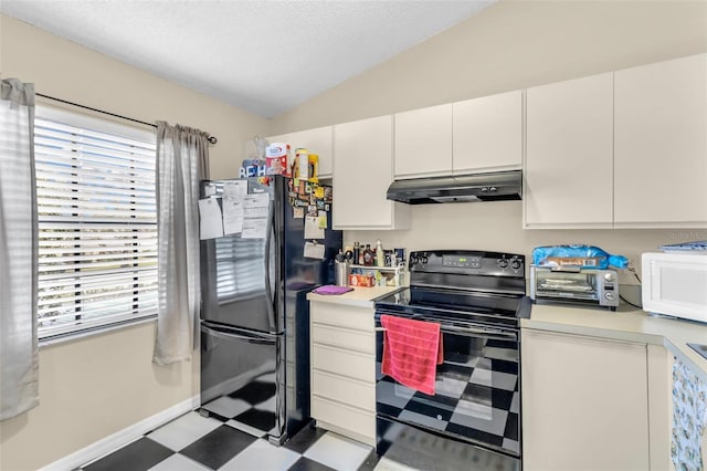 kitchen with black appliances, vaulted ceiling, and white cabinets