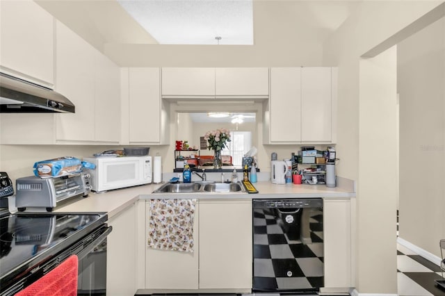 kitchen with sink, black appliances, and white cabinetry