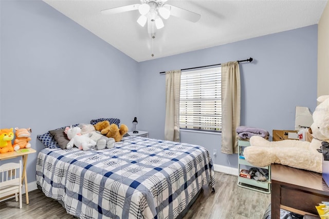 bedroom featuring hardwood / wood-style flooring and ceiling fan