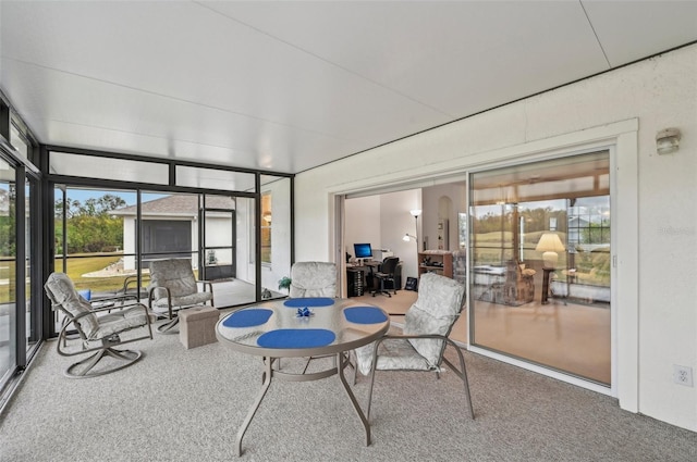 sunroom / solarium featuring a healthy amount of sunlight