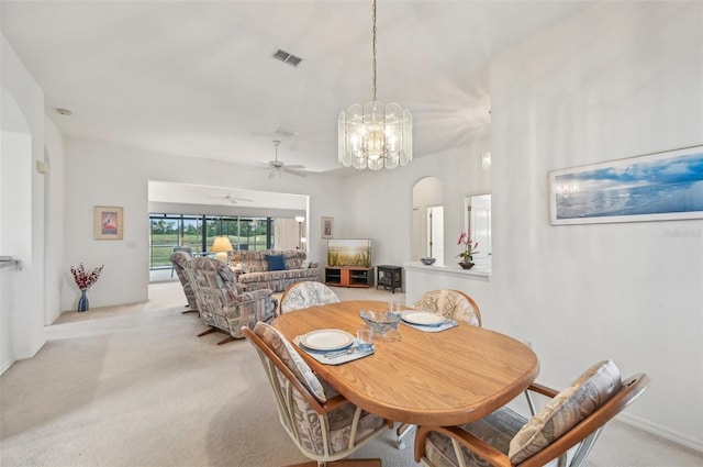 dining space featuring light carpet