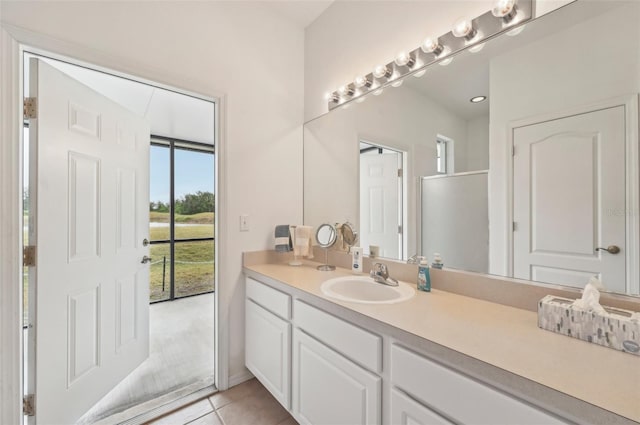 bathroom featuring vanity and tile patterned flooring