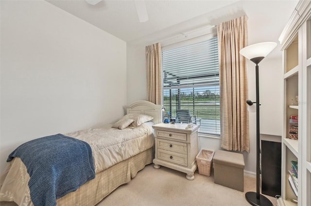 carpeted bedroom with ceiling fan