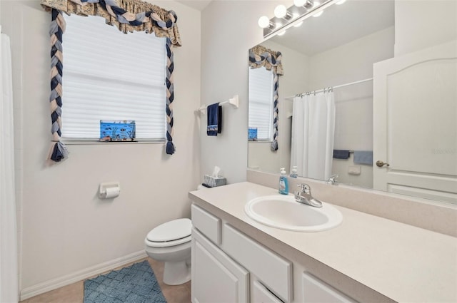 bathroom with tile patterned floors, toilet, and vanity