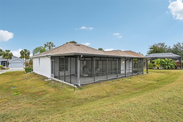 back of house with a lawn