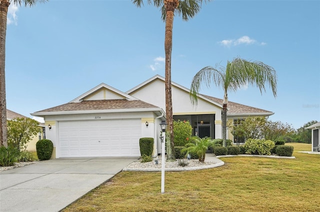 single story home with a front yard and a garage