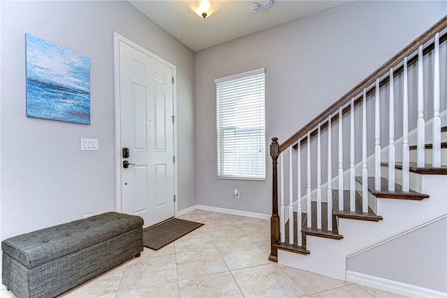 entrance foyer featuring light tile patterned flooring