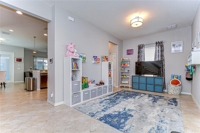 game room featuring light tile patterned floors