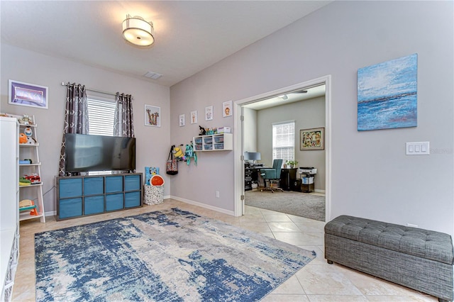 game room with light tile patterned floors and plenty of natural light