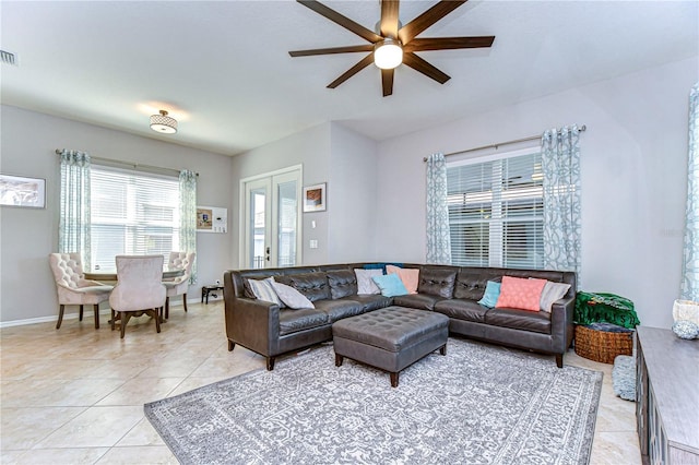 living room with light tile patterned floors, french doors, and ceiling fan