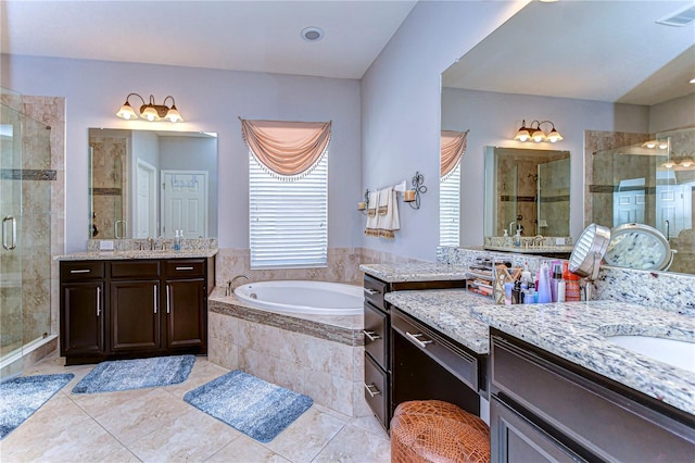 bathroom featuring tile patterned flooring, plus walk in shower, and vanity