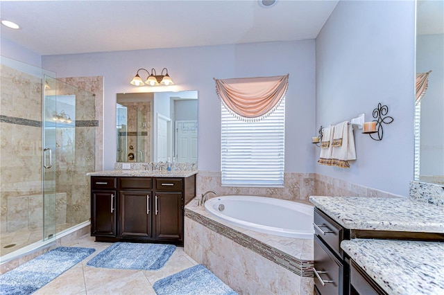 bathroom with vanity, separate shower and tub, and tile patterned flooring