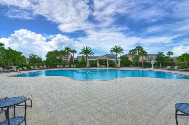 view of swimming pool with a patio