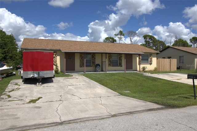 single story home with a front yard