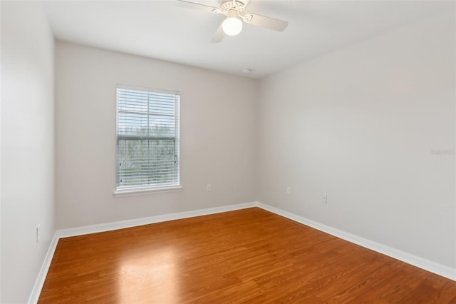 spare room featuring ceiling fan and hardwood / wood-style floors