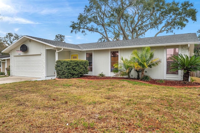 single story home featuring a garage and a front yard