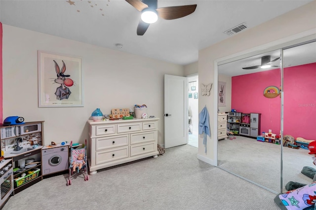 rec room with ceiling fan and light colored carpet