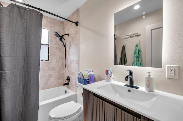 full bathroom with vanity, toilet, and shower / bath combo with shower curtain