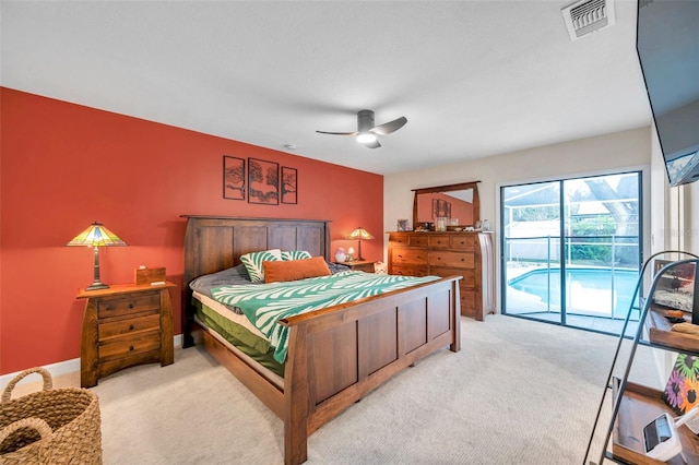 bedroom featuring light carpet, ceiling fan, visible vents, and access to exterior