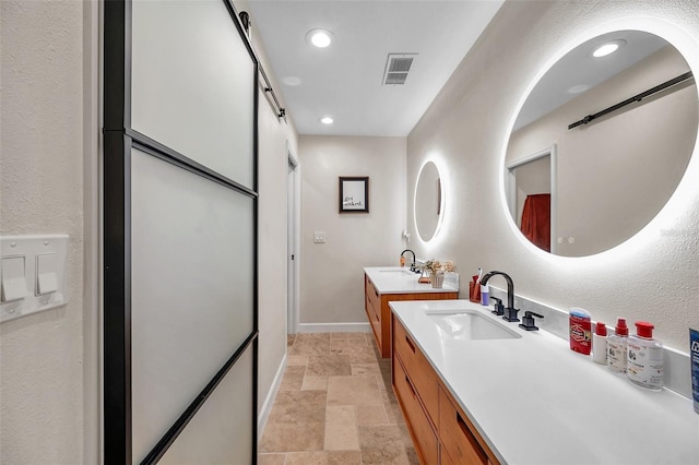 bathroom with recessed lighting, stone tile flooring, visible vents, vanity, and baseboards