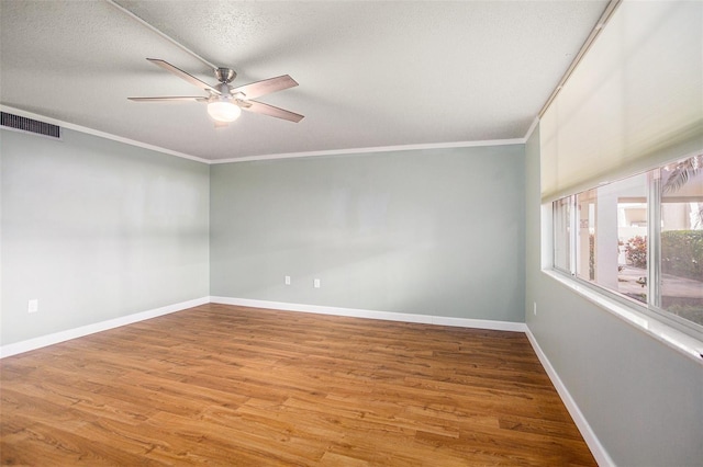 2635 Seville Blvd Unit 109, Clearwater, FL 33764 - unfurnished room featuring hardwood / wood-style flooring, ceiling fan, crown molding, and a textured ceiling