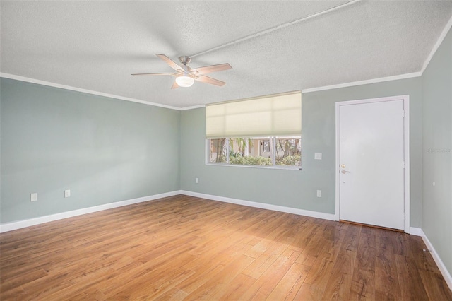 2635 Seville Blvd Unit 109, Clearwater, FL 33764 - unfurnished room with hardwood / wood-style flooring, ceiling fan, ornamental molding, and a textured ceiling