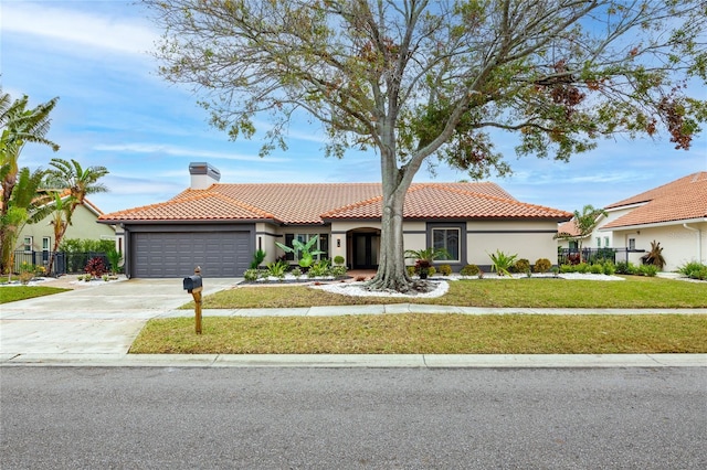 5809 Cruiser Way, Tampa, FL 33615 - mediterranean / spanish-style home with a chimney, a garage, a tiled roof, and stucco siding