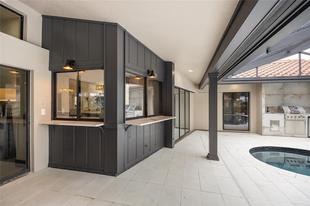 5809 Cruiser Way, Tampa, FL 33615 - view of patio / terrace featuring exterior kitchen and a hot tub