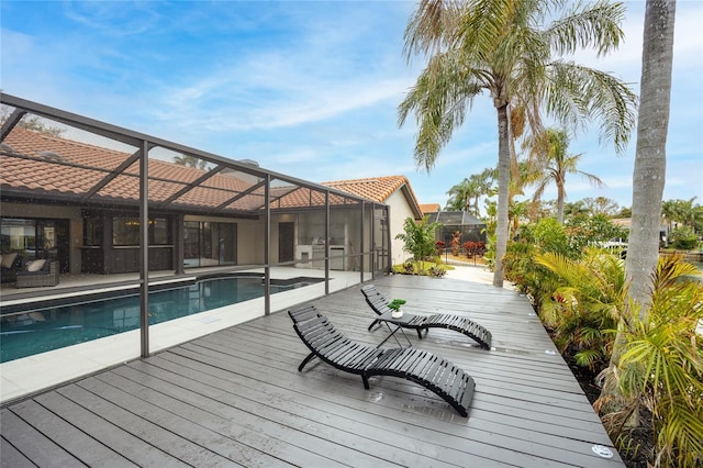 5809 Cruiser Way, Tampa, FL 33615 - wooden deck featuring an outdoor pool and glass enclosure