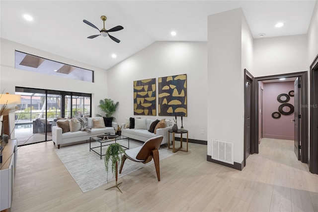 5809 Cruiser Way, Tampa, FL 33615 - living room with high vaulted ceiling, ceiling fan, light wood finished floors, and recessed lighting