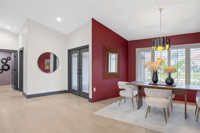 5809 Cruiser Way, Tampa, FL 33615 - dining room with a chandelier, lofted ceiling, light wood-style floors, and french doors