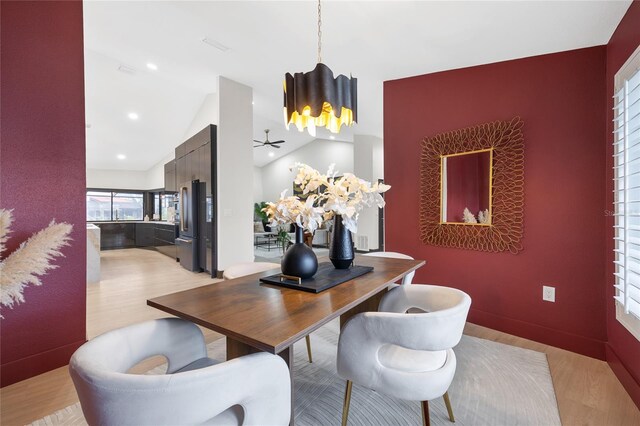 5809 Cruiser Way, Tampa, FL 33615 - dining area featuring light wood finished floors, vaulted ceiling, ceiling fan, recessed lighting, and an accent wall