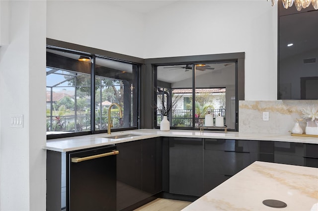 5809 Cruiser Way, Tampa, FL 33615 - kitchen with modern cabinets, dishwasher, healthy amount of natural light, and dark cabinets