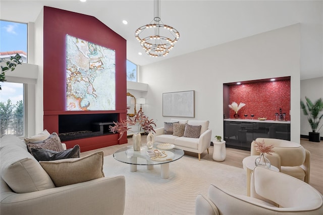 5809 Cruiser Way, Tampa, FL 33615 - living room featuring high vaulted ceiling, a chandelier, plenty of natural light, recessed lighting, and wood finished floors